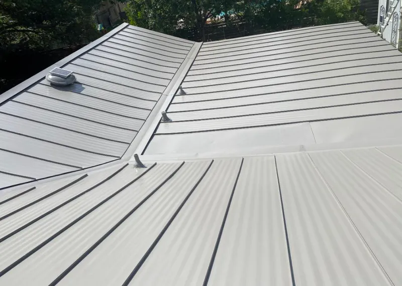 Solar attic fan installed on a metal roof for Roof Ventilation in Victoria